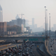 A haze lingers over Atlanta’s skyline from a large fire burning in northwestern Georgia. Image: David Goldman/AP